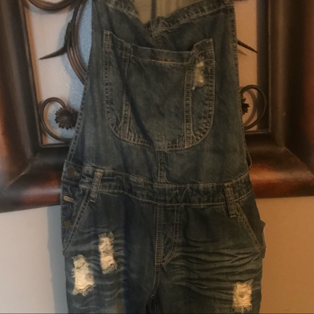 Destroyed denim jumpsuit